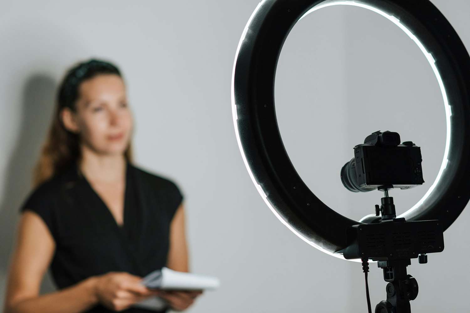 Stock image of presenter in front of a camera 